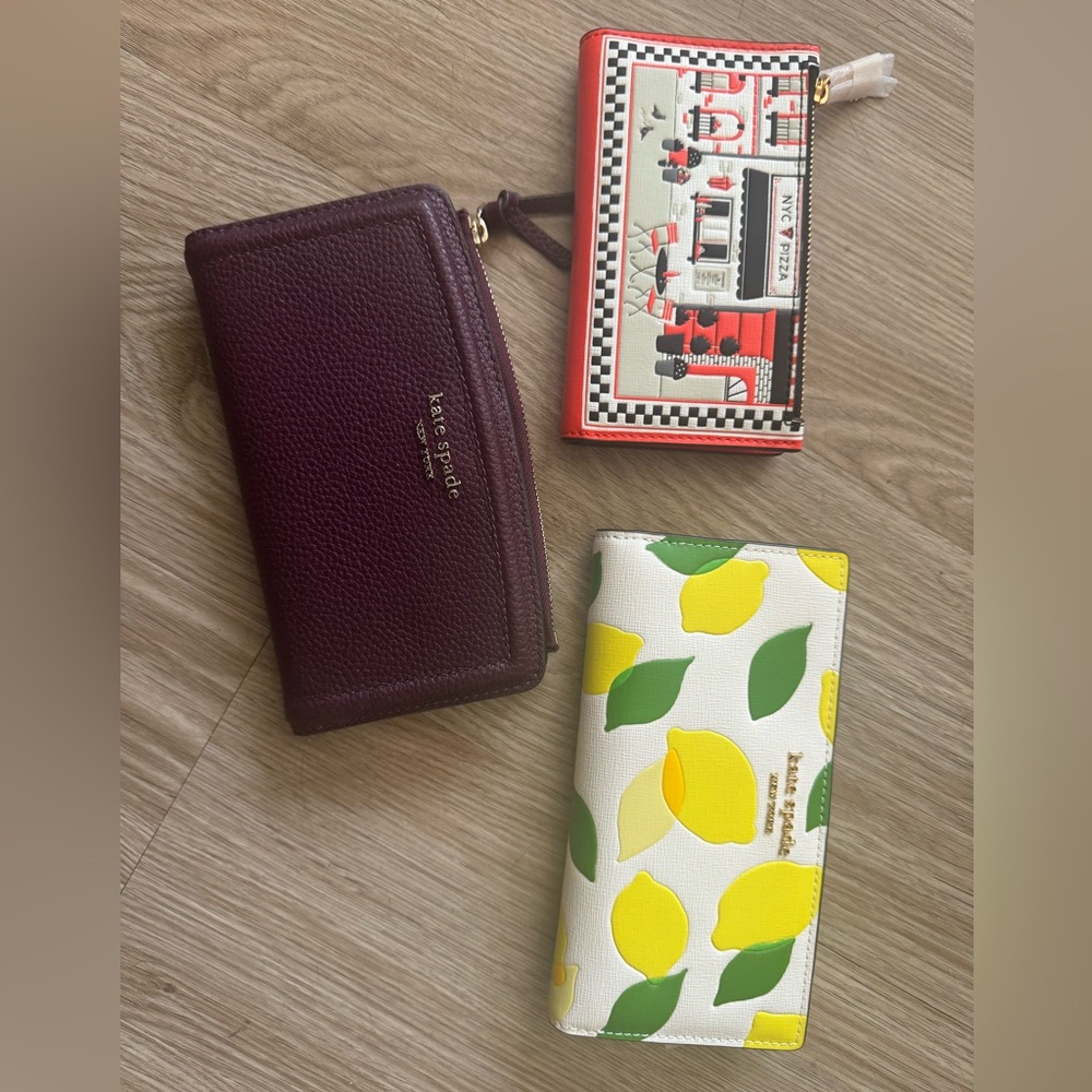 Three brand new Kate spade wallets. Perfect condition